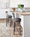 Caitbrook Bar Height Bar Stool - Affordable Home Luxury