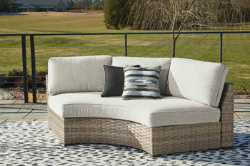 Calworth Outdoor Curved Loveseat with Cushion - Affordable Home Luxury