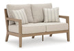 Hallow Creek Outdoor Loveseat with Cushion - Affordable Home Luxury